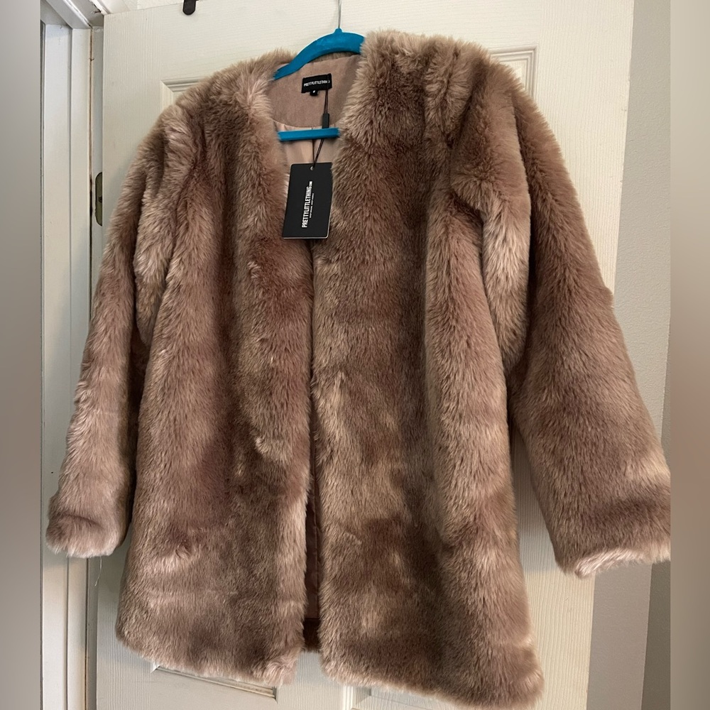 This beautiful faux fur jacket is from Pretty Little Things, size 6 light brown.